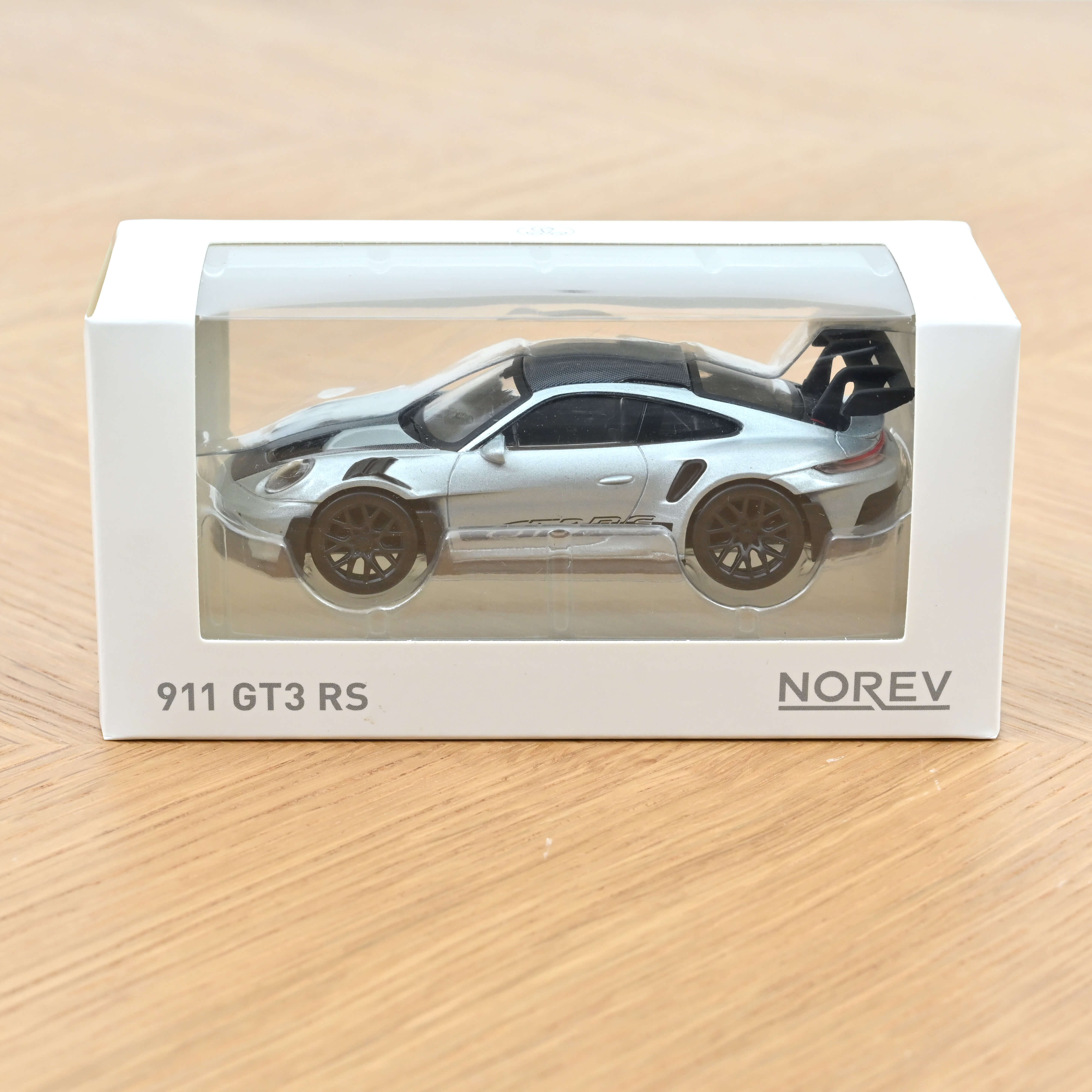 norev-porsche-911-gt3-rs-2022-modellino-auto-1-43-argento-e-nero-jet-car image 2