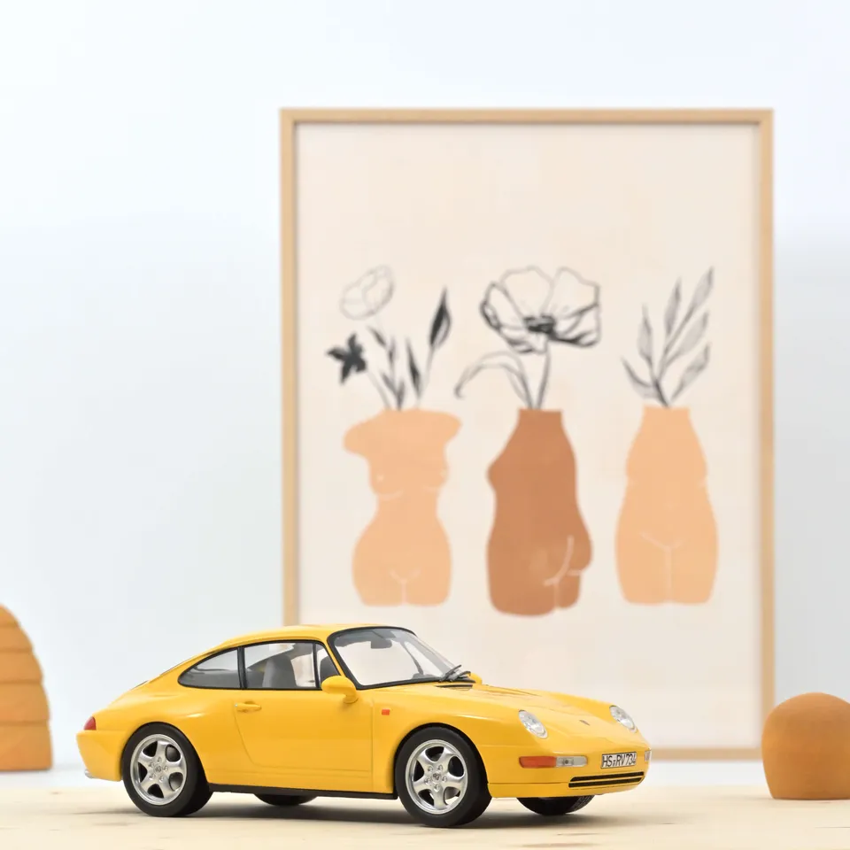 norev-porsche-911-carrera-1994-modellino-auto-1-18-giallo image 1