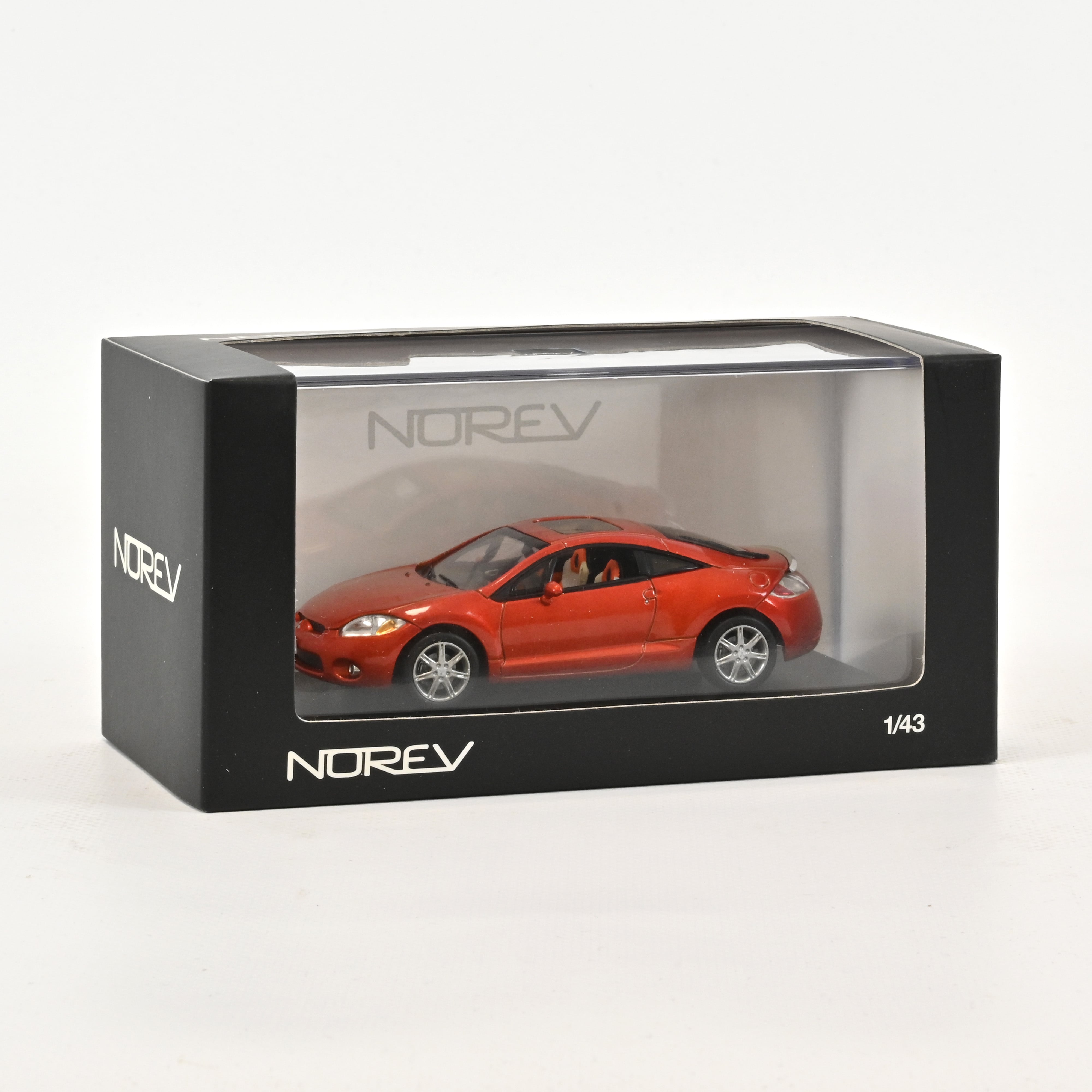 norev-mitsubishi-eclipse-coup-2006-orange-bizen-1-43-modellino-auto image 1