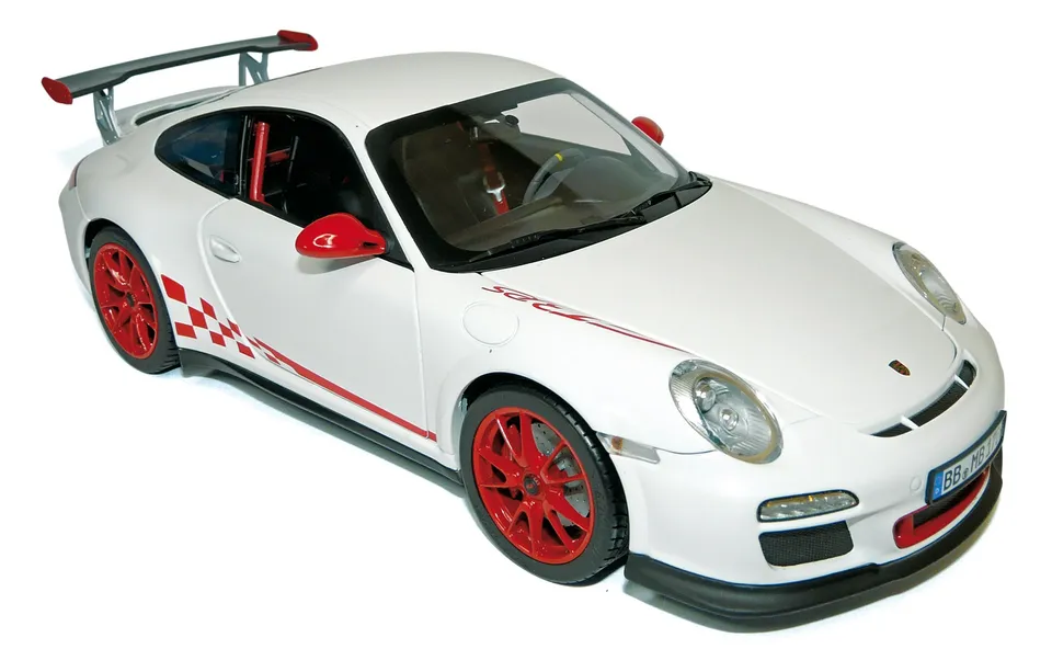 norev-porsche-911-gt3-rs-2010-modellino-auto-1-18-bianca-con-deco-rossa image 1