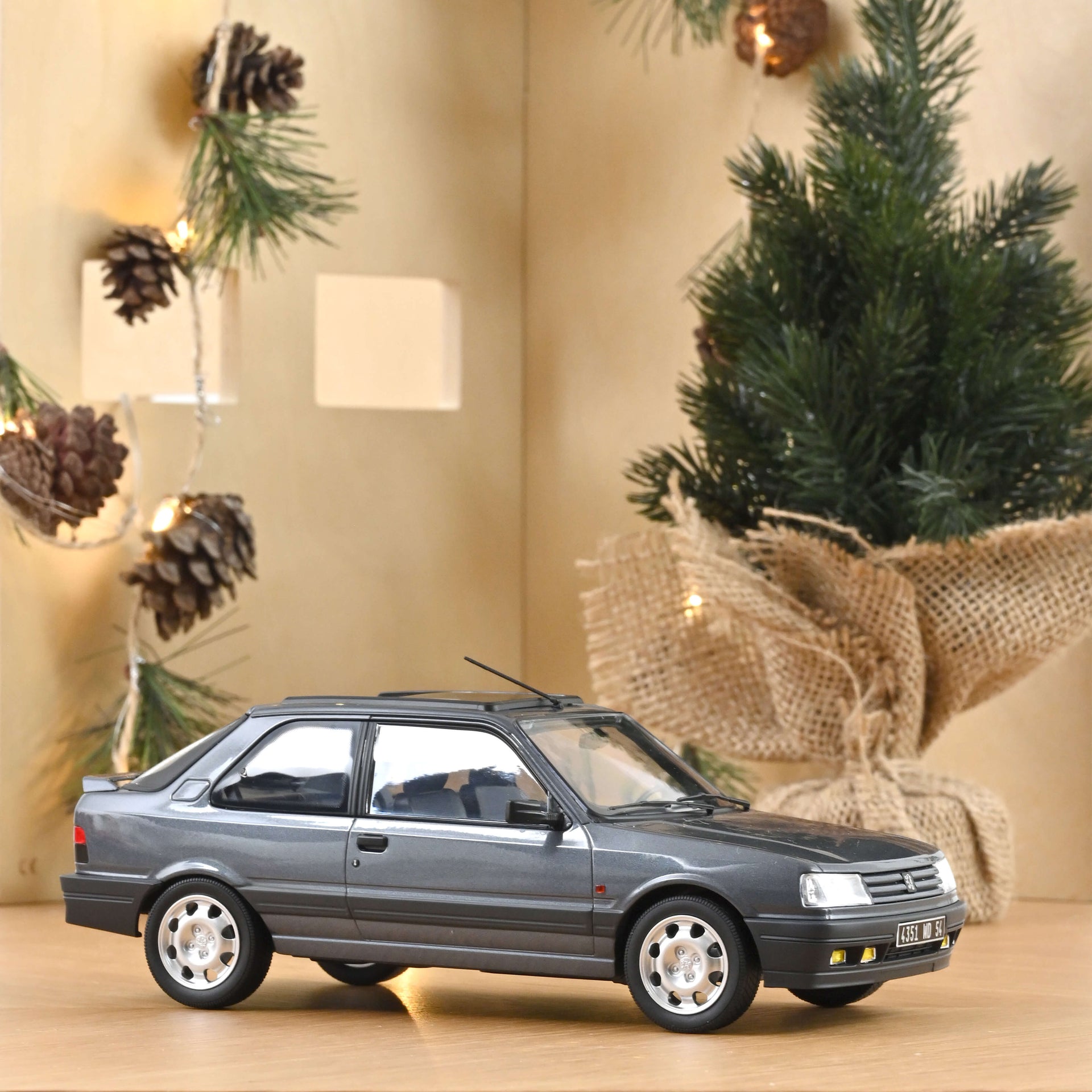 norev-peugeot-309-gti-16-1991-modellino-auto-1-18-grigio-magnum-edizione-300-pz image 1