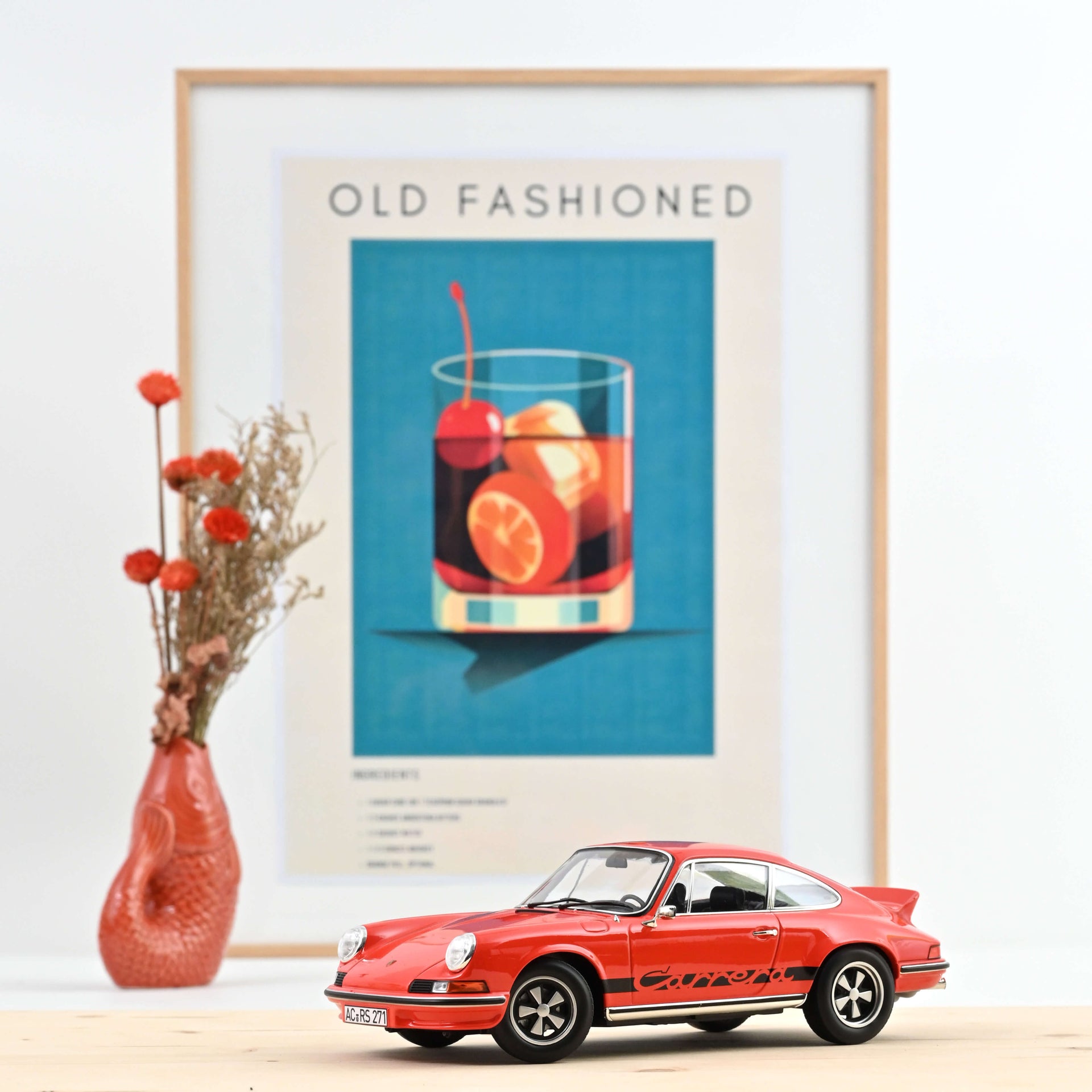 norev-porsche-911-rs-1973-arancione-nero-modellino-auto-1-18-300-pz image 1