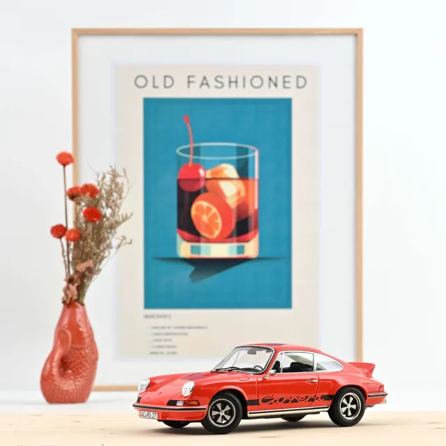 norev-porsche-911-rs-1973-modellino-1-18-arancione-e-nero-edizione-300pz image 1