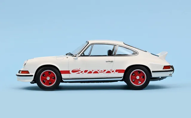 norev-porsche-911-carrera-rs-1973-bianca-con-deco-rossa-modellino-1-18 image 1