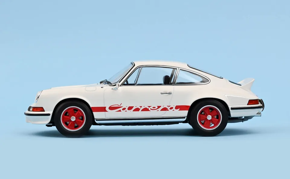 norev-porsche-911-carrera-rs-1973-bianca-con-deco-rossa-modellino-1-18 image 1